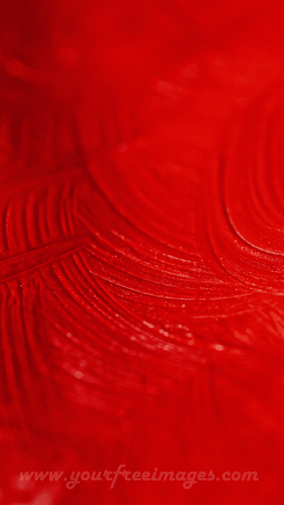 Red sand formations set against a dark black background