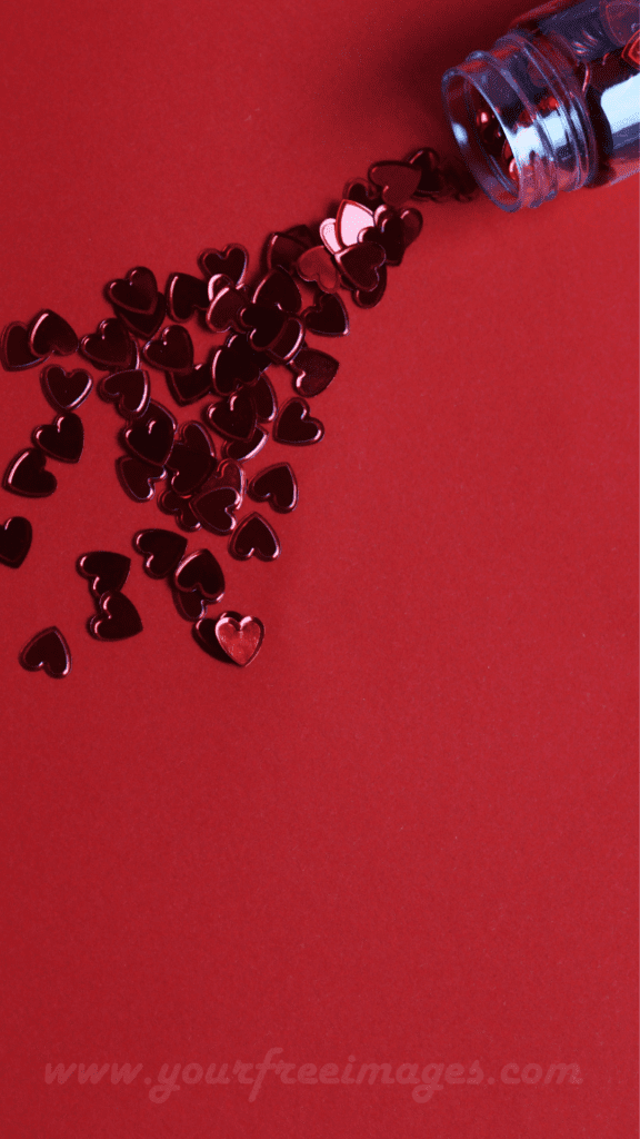 Adorable red hearts scattered on a black background