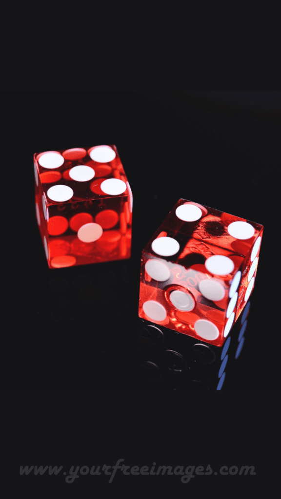 Dark red dice on a black background hd image